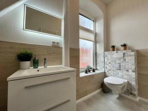 Koupelna v ubytování Duplex Villa Dünenbrise