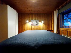 Ένα ή περισσότερα κρεβάτια σε δωμάτιο στο Kelotupa 19
