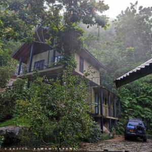 a car parked in front of a house at Forest Shade Eco Resort in Deraniyagala