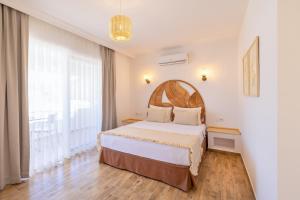 Postel nebo postele na pokoji v ubytování Base Selimiye