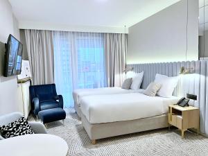 Royal Tulip Warsaw Centre客房内的一张或多张床位