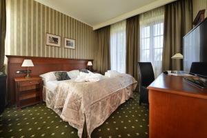 Postel nebo postele na pokoji v ubytování Hotel Morris Relax & Wellness