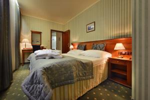 Postel nebo postele na pokoji v ubytování Hotel Morris Relax & Wellness