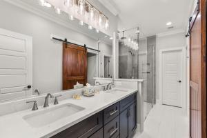 a bathroom with a sink and a large mirror at Relax, Rewind, Repeat - New Country Cottage in High Point +33 photos