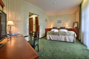 Postel nebo postele na pokoji v ubytování Hotel Morris Relax & Wellness