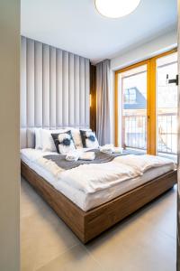 Un ou plusieurs lits dans un hébergement de l'établissement Apartament Owca na wypasie by Apart Concept Podhale