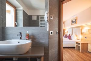 Posteľ alebo postele v izbe v ubytovaní Albergo Belvedere