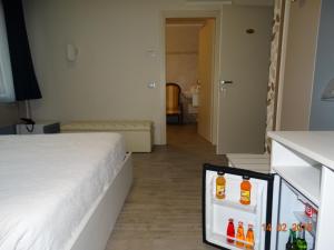 Postel nebo postele na pokoji v ubytování Hotel Moderno