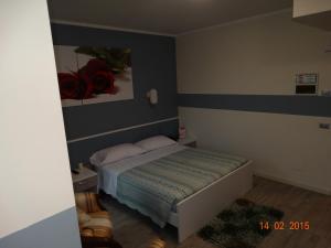 Postel nebo postele na pokoji v ubytování Hotel Moderno