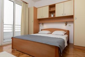 Posteľ alebo postele v izbe v ubytovaní Apartmani Vela