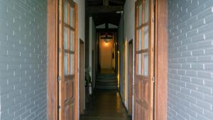 an empty hallway with two doors and a staircase at Pousada Monttana in Lavras Novas