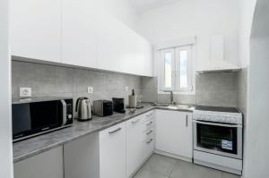 Kuchyňa alebo kuchynka v ubytovaní CASA ANNA LOFT Boutique House with Full Sea View