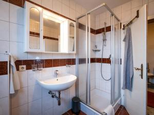 a bathroom with a sink and a shower at Ferienwohnung Wallner in Zell am Ziller