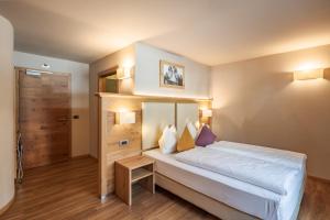 Posteľ alebo postele v izbe v ubytovaní Albergo Belvedere