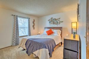 a bedroom with a bed and a window at Family-Friendly Aurora Vacation Rental with Yard! in Aurora