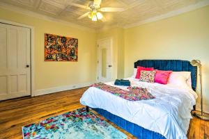 a bedroom with a large bed and a ceiling fan at Troy Townhome 10 Mi to Downtown Albany! in Troy