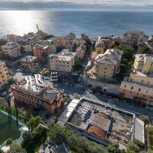 an aerial view of a city next to the ocean at Rex Hotel Residence in Genoa