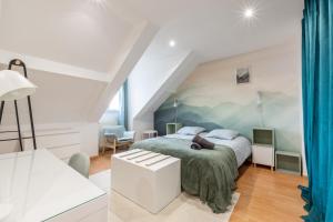 a bedroom with a bed in a room at Duplex Chancelier - Fairytale Factory in Bussy-Saint-Georges