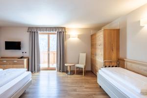 Posteľ alebo postele v izbe v ubytovaní Albergo Belvedere