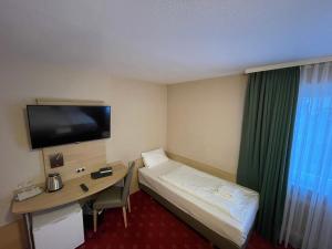 TV o dispositivi per l'intrattenimento presso Hafner Hotel Apartment Self Check-In Anytime