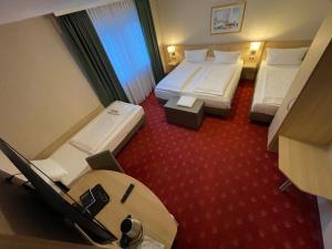 Letto o letti in una camera di Hafner Hotel Apartment Self Check-In Anytime