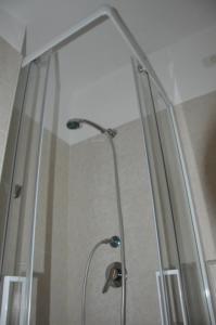 a shower with a glass door in a bathroom at Isolabella in Foce Varano