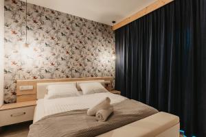 Posteľ alebo postele v izbe v ubytovaní Apartamenty Sobiczkowa