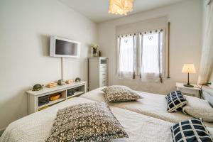 Posteľ alebo postele v izbe v ubytovaní Vivalidays ilaria - Calella
