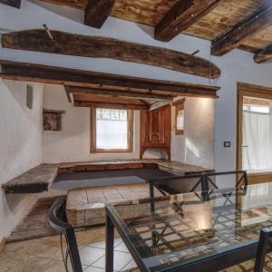a room with a bed and a glass table at Romantic Boutique Hospitality in Revine Lago +32 photos