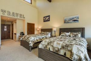 a bedroom with two beds and a sign that reads travel at Tamarron Lodge Studio - 406 in Durango +37 photos