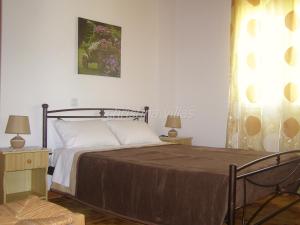 Postel nebo postele na pokoji v ubytování Christina Villas