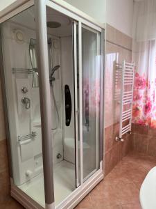 a glass shower in a bathroom with a toilet at Appartamenti Estivi in Cirò Marina