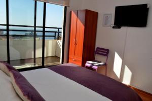 Rúm í herbergi á B&B Hostel CasaMoro