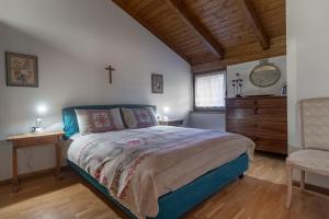 Postel nebo postele na pokoji v ubytování DolomiApartments - Casa Margherita