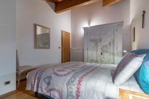 Postel nebo postele na pokoji v ubytování DolomiApartments - Casa Margherita