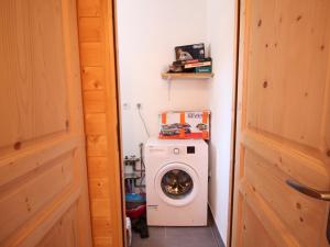 a washer and dryer in a small room at Chalet Mont-Dore, 5 pièces, 8 personnes - FR-1-608-223 in Le Mont-Dore