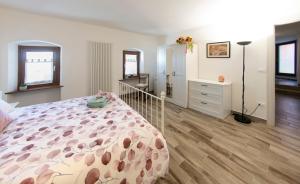 Llit o llits en una habitació de Appartamento La Scaletta