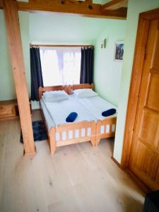 Postel nebo postele na pokoji v ubytování Vila Kopa Nida