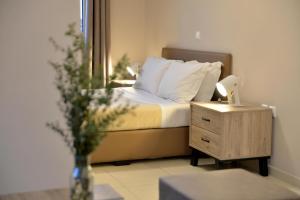 Ένα ή περισσότερα κρεβάτια σε δωμάτιο στο Alekos Apartments 1 Νetflix