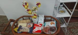 a basket full of food and snacks on a table at Terra d'Amuri Hotel in Catania