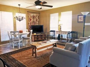 a living room with a couch and a table at Inn at Indian Creek in Burton