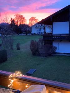 a view of a house with a screen in a yard at Fewo Christine in Prien am Chiemsee
