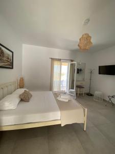 Postel nebo postele na pokoji v ubytování Louros rooms