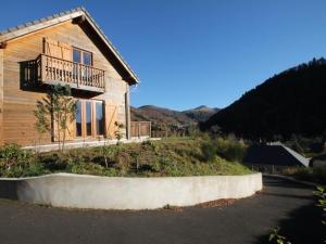 a house with a balcony on the side of it at Chalet Mont-Dore, 4 pièces, 6 personnes - FR-1-608-10 in Le Mont-Dore