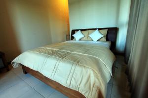 Postel nebo postele na pokoji v ubytování Ubud Canti Accommodation