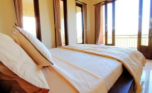 Postel nebo postele na pokoji v ubytování Ubud Canti Accommodation
