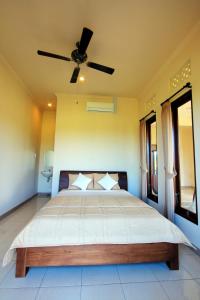 מיטה או מיטות בחדר ב-Ubud Canti Accommodation