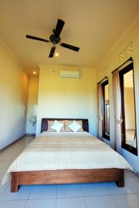 Postel nebo postele na pokoji v ubytování Ubud Canti Accommodation