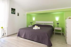 A bed or beds in a room at Residence Rossomelograno