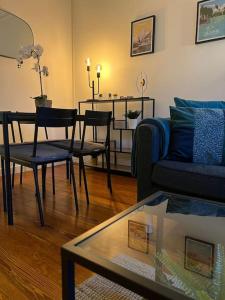 a living room with a couch and a table at P&R 2, 2 bedroom, close to center, Plainpalais in Geneva